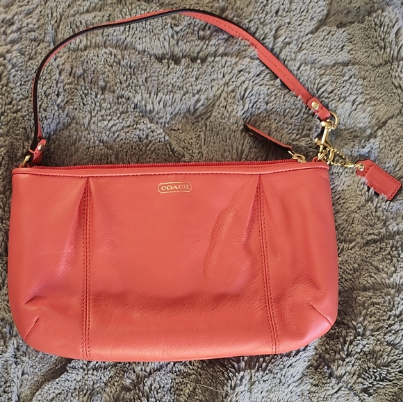 Like new Coach Large wristlet in redish or coral color - Picture 1 of 8
